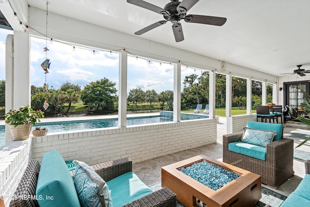 1786 Selva Marina Dr, Atlantic Beach, FL 32233 - sunroom / solarium featuring ceiling fan, plenty of natural light, and an outdoor living space with a fire pit