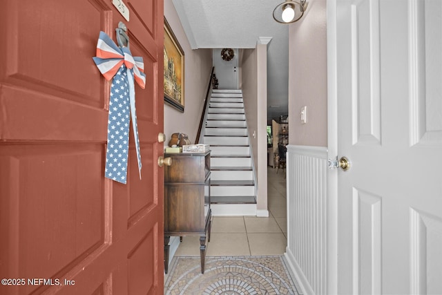 5811 Atlantic Blvd Unit 25, Jacksonville, FL 32207 - foyer entrance featuring light tile patterned floors and stairs