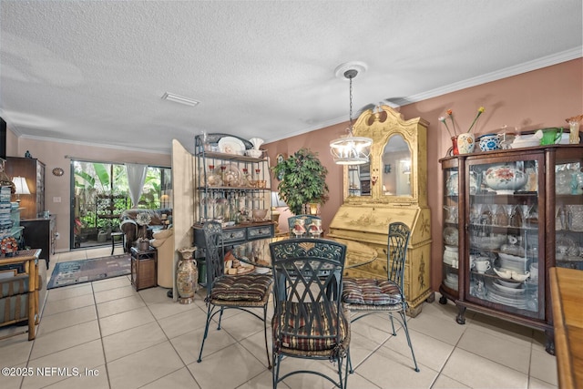 5811 Atlantic Blvd Unit 25, Jacksonville, FL 32207 - dining area with tile patterned flooring, ornamental molding, and a textured ceiling