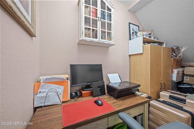 5811 Atlantic Blvd Unit 25, Jacksonville, FL 32207 - office area featuring a textured wall, wood finished floors, and vaulted ceiling
