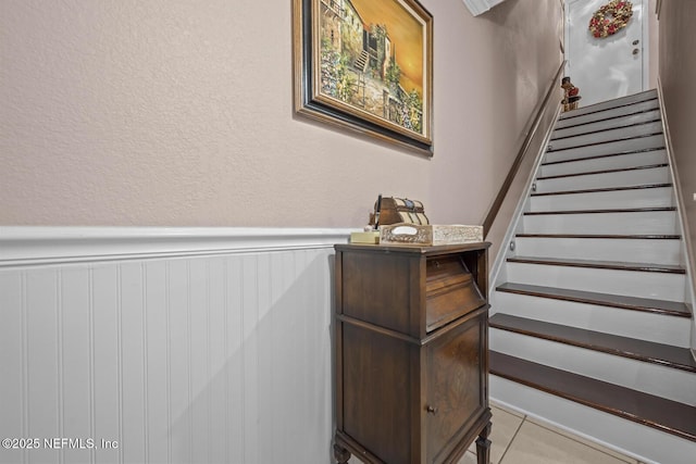 5811 Atlantic Blvd Unit 25, Jacksonville, FL 32207 - stairway with wainscoting and tile patterned floors