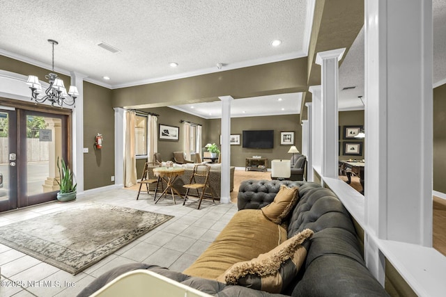 5811 Atlantic Blvd Unit 25, Jacksonville, FL 32207 - living room featuring a chandelier, crown molding, light tile patterned floors, recessed lighting, and a textured ceiling