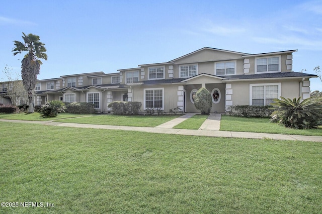 3164 Ravines Rd, Middleburg, FL 32068 - townhome / multi-family property with stucco siding and a front lawn