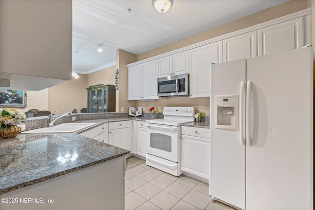 160 Legendary Dr Unit 204, Saint Augustine, FL 32092 - kitchen featuring white appliances, white cabinets, light tile patterned flooring, ornamental molding, and dark stone counters