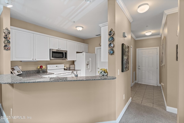 160 Legendary Dr Unit 204, Saint Augustine, FL 32092 - kitchen featuring white appliances, stone countertops, light tile patterned floors, white cabinets, and crown molding