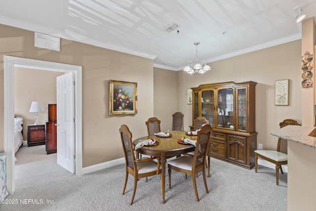 160 Legendary Dr Unit 204, Saint Augustine, FL 32092 - dining area featuring light colored carpet, ornamental molding, and a chandelier