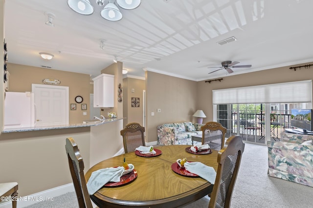 160 Legendary Dr Unit 204, Saint Augustine, FL 32092 - dining space with carpet floors, a ceiling fan, and crown molding