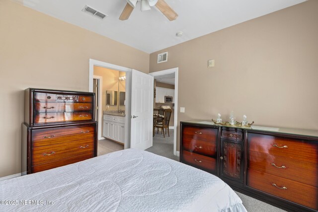 160 Legendary Dr Unit 204, Saint Augustine, FL 32092 - bedroom featuring carpet floors, connected bathroom, and ceiling fan