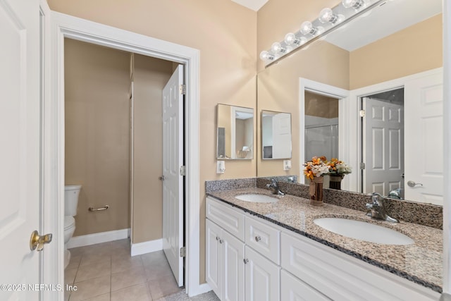 160 Legendary Dr Unit 204, Saint Augustine, FL 32092 - bathroom with double vanity, tile patterned floors, and an enclosed shower