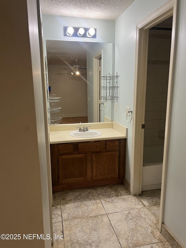 1102 Wood Hill Pl Unit 1102, Jacksonville, FL 32256 - full bathroom featuring vanity, a textured ceiling, a ceiling fan, and tile patterned flooring