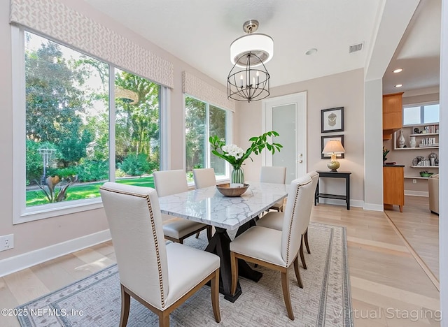 1356 Barrington Cir, Saint Augustine, FL 32092 - dining room with a chandelier, light wood-style floors, and recessed lighting
