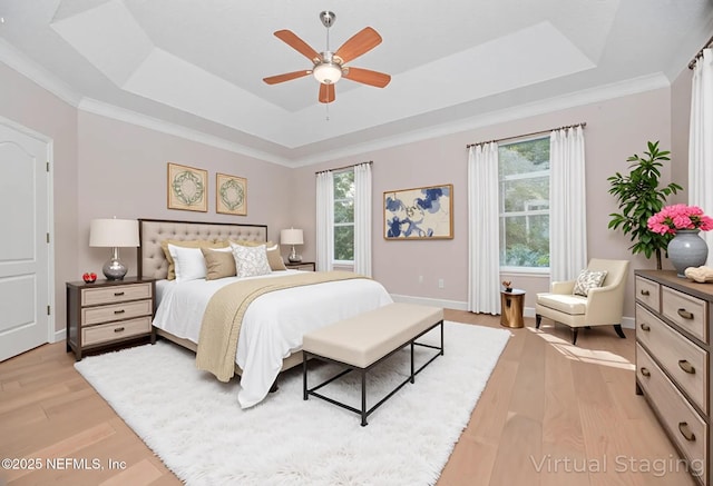 1356 Barrington Cir, Saint Augustine, FL 32092 - bedroom with a raised ceiling, light wood-style floors, and ceiling fan