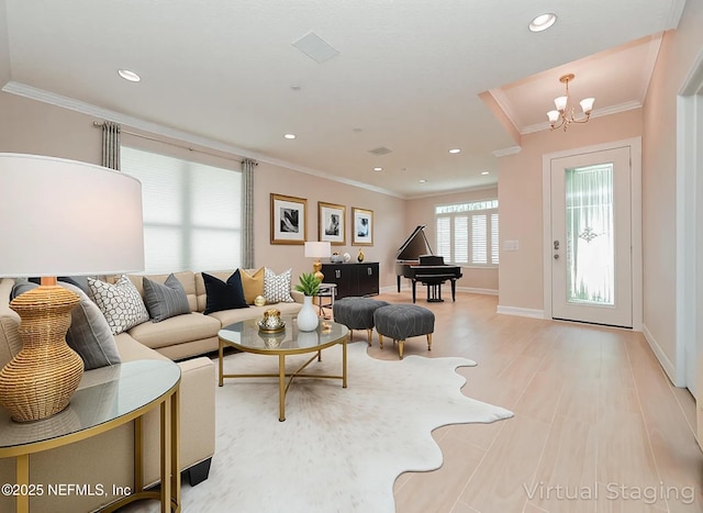 1356 Barrington Cir, Saint Augustine, FL 32092 - living room featuring ornamental molding, recessed lighting, a chandelier, and light wood-type flooring