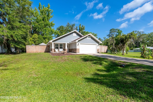 210 N Saint Clair St, Starke, FL 32091 - craftsman inspired home featuring an attached garage, concrete driveway, and stone siding