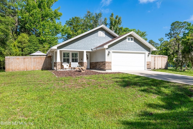 210 N Saint Clair St, Starke, FL 32091 - craftsman-style house featuring a garage, concrete driveway, and stone siding