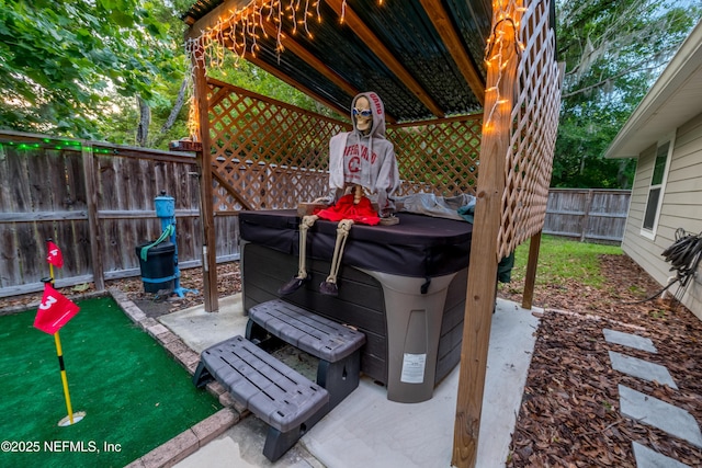 210 N Saint Clair St, Starke, FL 32091 - fenced backyard with a hot tub and a putting area