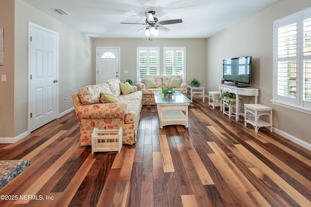 210 N Saint Clair St, Starke, FL 32091 - living room with dark wood-style flooring and a ceiling fan