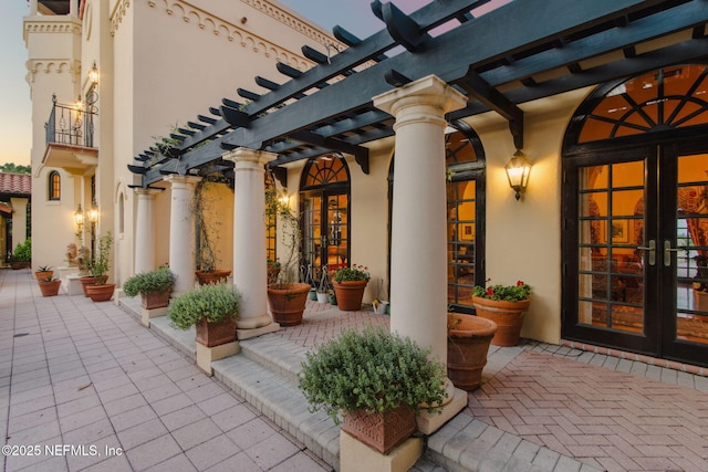 1185 Ponte Vedra Blvd, Ponte Vedra Beach, FL 32082 - patio terrace at dusk with french doors and a pergola
