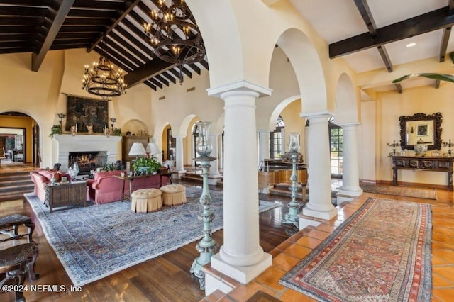 1185 Ponte Vedra Blvd, Ponte Vedra Beach, FL 32082 - foyer featuring beamed ceiling, a towering ceiling, a fireplace, a chandelier, and arched walkways