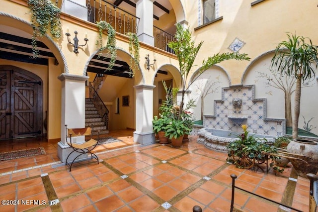 1185 Ponte Vedra Blvd, Ponte Vedra Beach, FL 32082 - patio / terrace with exterior fireplace, stairway, and a patio