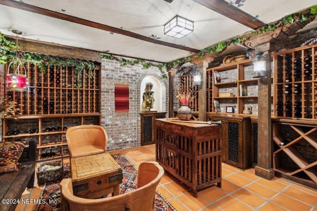 1185 Ponte Vedra Blvd, Ponte Vedra Beach, FL 32082 - wine cellar with light tile patterned flooring, beam ceiling, and brick wall