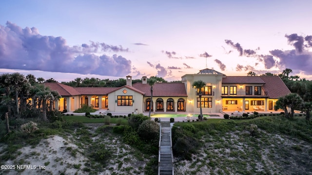 1185 Ponte Vedra Blvd, Ponte Vedra Beach, FL 32082 - view of front facade featuring a tile roof, a chimney, and stucco siding