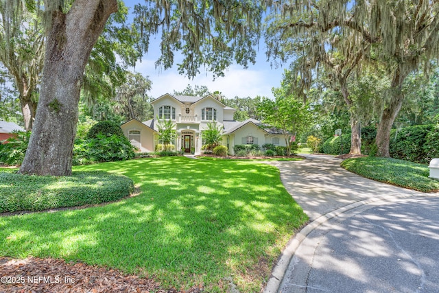 312 Bartram Trl, Saint Johns, FL 32259 - view of front of property with a front lawn, concrete driveway, and stucco siding