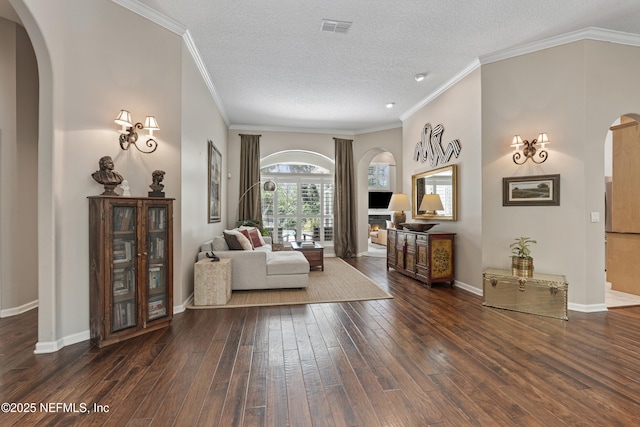 312 Bartram Trl, Saint Johns, FL 32259 - living room with arched walkways, wood-type flooring, ornamental molding, and a textured ceiling
