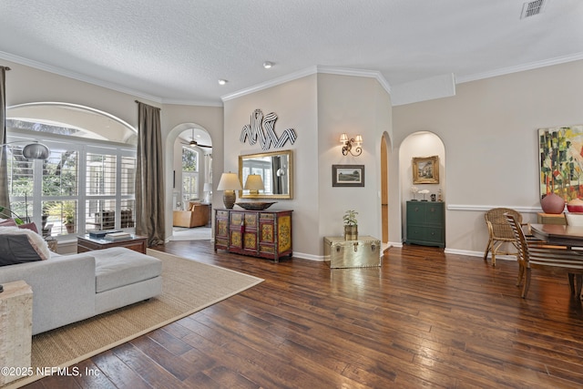 312 Bartram Trl, Saint Johns, FL 32259 - living area with arched walkways, wood-type flooring, crown molding, and a textured ceiling