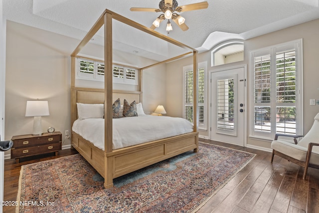 312 Bartram Trl, Saint Johns, FL 32259 - bedroom with access to outside, wood-type flooring, and a textured ceiling