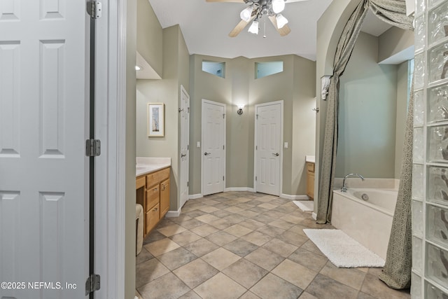 312 Bartram Trl, Saint Johns, FL 32259 - bathroom featuring vanity, a bath, a ceiling fan, and a closet
