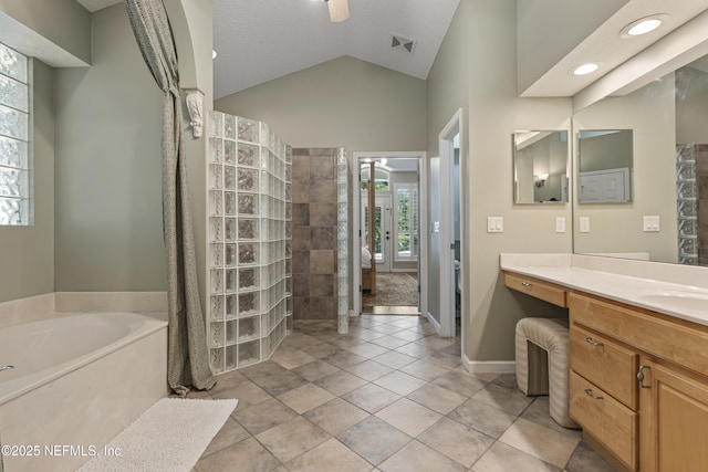 312 Bartram Trl, Saint Johns, FL 32259 - full bath with vanity, vaulted ceiling, a garden tub, and a walk in shower