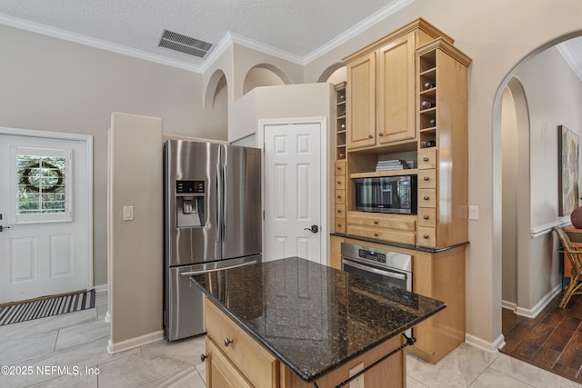 312 Bartram Trl, Saint Johns, FL 32259 - kitchen with appliances with stainless steel finishes, open shelves, light brown cabinets, crown molding, and dark stone countertops