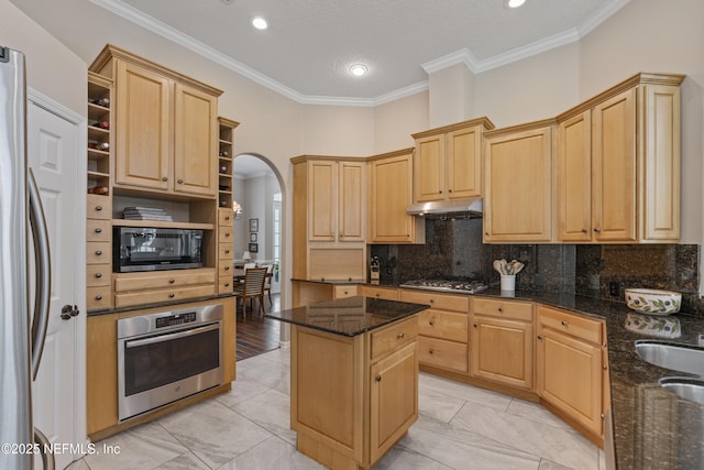 312 Bartram Trl, Saint Johns, FL 32259 - kitchen with stainless steel appliances, open shelves, arched walkways, light brown cabinetry, and crown molding