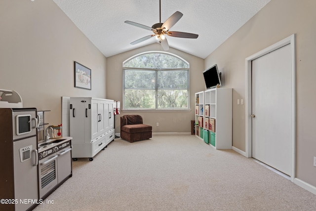 312 Bartram Trl, Saint Johns, FL 32259 - recreation room featuring vaulted ceiling, ceiling fan, light carpet, and a textured ceiling