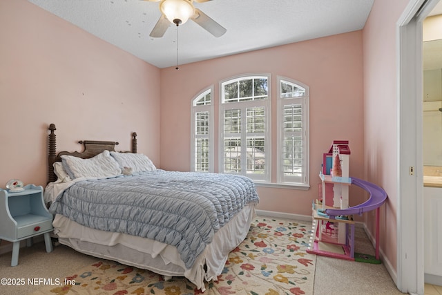 312 Bartram Trl, Saint Johns, FL 32259 - bedroom featuring multiple windows, light carpet, ensuite bathroom, and a ceiling fan