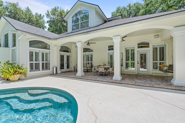 312 Bartram Trl, Saint Johns, FL 32259 - rear view of house featuring french doors, a patio, an outdoor pool, and a shingled roof
