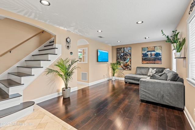 4807 Evenlode Ln Unit B-1-D, Jacksonville, FL 32217 - living room featuring recessed lighting, wood finished floors, stairs, and arched walkways