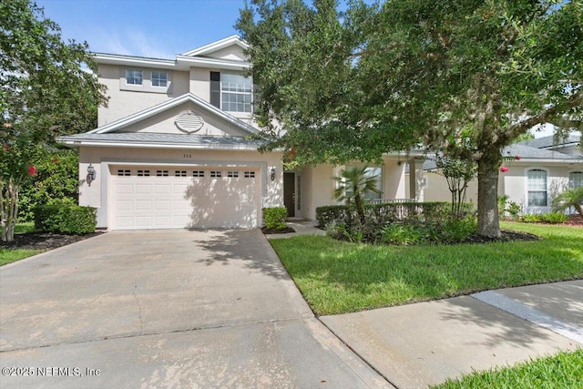 336 Edge Of Woods Rd, Saint Augustine, FL 32092 - view of front of property with driveway, stucco siding, and a front lawn