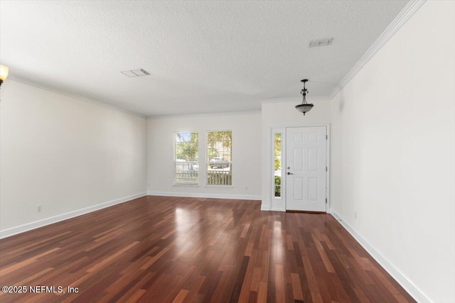 336 Edge Of Woods Rd, Saint Augustine, FL 32092 - foyer entrance featuring a textured ceiling, dark wood-type flooring, and ornamental molding