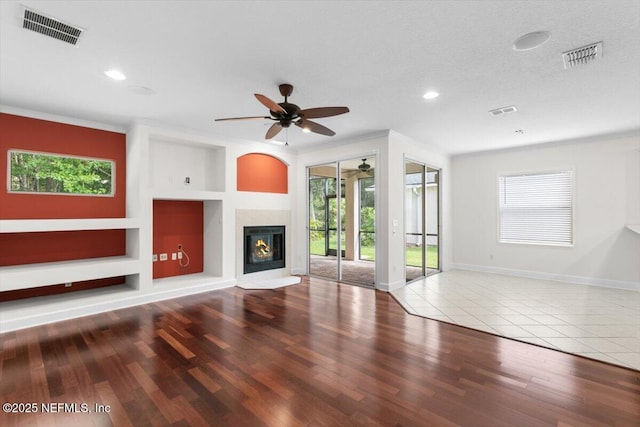 336 Edge Of Woods Rd, Saint Augustine, FL 32092 - unfurnished living room with crown molding, ceiling fan, built in shelves, recessed lighting, and wood finished floors