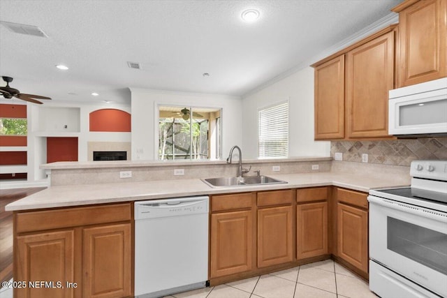 336 Edge Of Woods Rd, Saint Augustine, FL 32092 - kitchen with white appliances, ceiling fan, plenty of natural light, a peninsula, and crown molding
