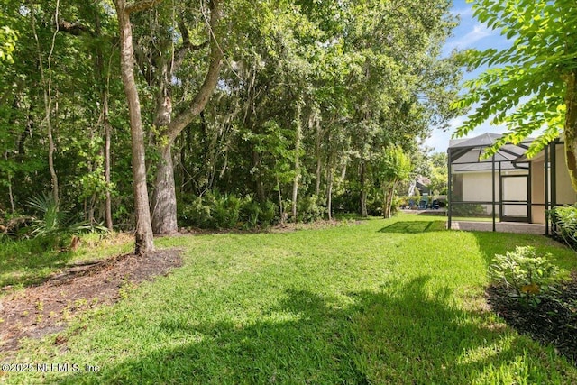 336 Edge Of Woods Rd, Saint Augustine, FL 32092 - view of grassy yard with a lanai