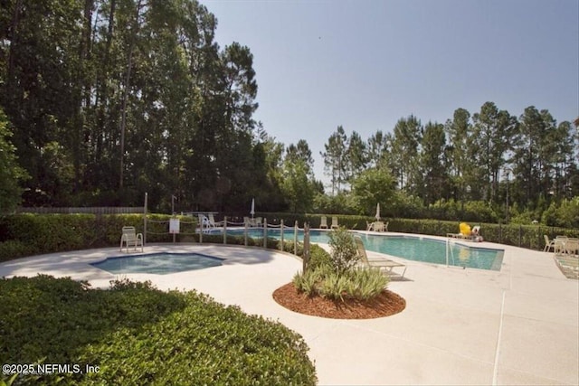336 Edge Of Woods Rd, Saint Augustine, FL 32092 - community pool with a patio area and view of scattered trees