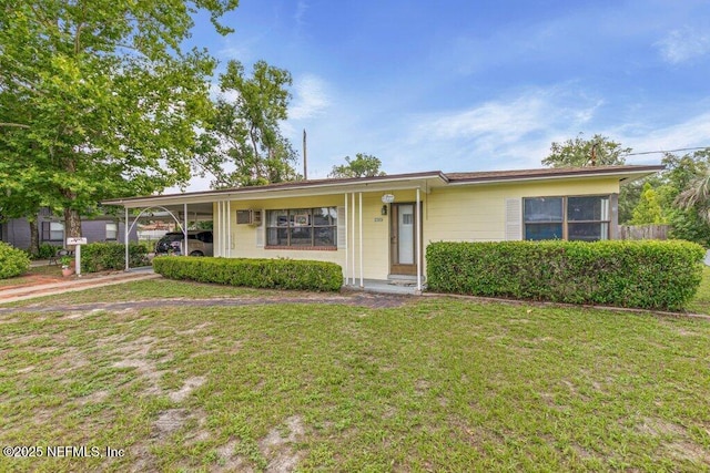 2305 Broward Rd, Jacksonville, FL 32218 - ranch-style home with a front lawn and an attached carport