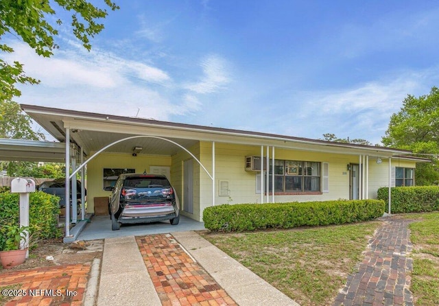 2305 Broward Rd, Jacksonville, FL 32218 - view of front facade featuring an attached carport and driveway