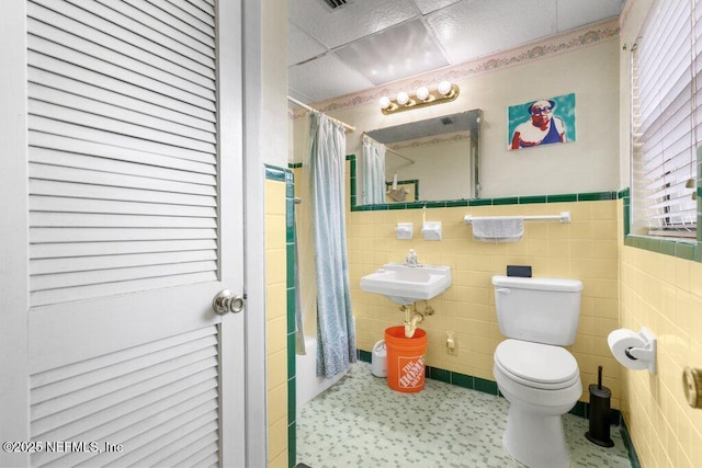2305 Broward Rd, Jacksonville, FL 32218 - bathroom featuring tile walls and wainscoting