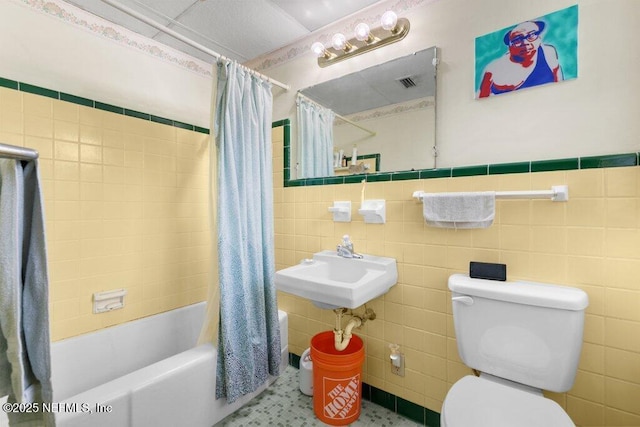 2305 Broward Rd, Jacksonville, FL 32218 - bathroom with tile walls, shower / bathtub combination with curtain, and wainscoting