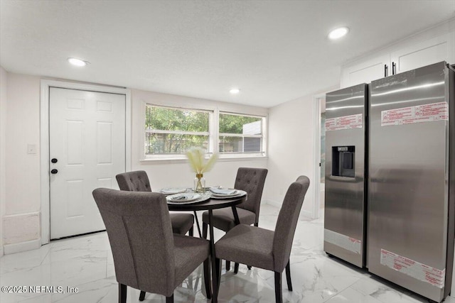 8940 Monroe Ave, Jacksonville, FL 32208 - dining area featuring light marble finish flooring and recessed lighting