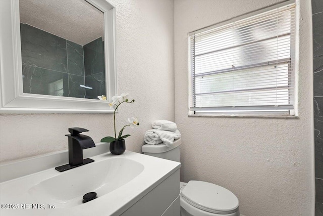 8940 Monroe Ave, Jacksonville, FL 32208 - bathroom with a textured wall and vanity